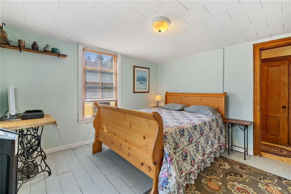 777 Main Street Addison, PA 15411 - Photo 21 of 35 a bedroom with a bed and a table in it