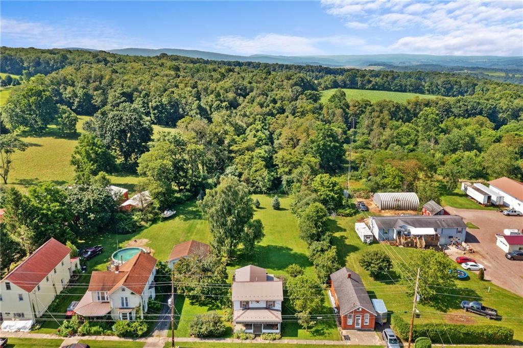 777 Main Street Addison, PA 15411 - Photo 31 of 35 an aerial view of residential houses with outdoor space and trees all around
