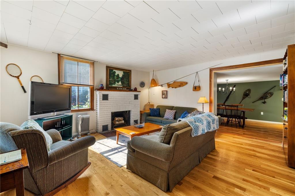 777 Main Street Addison, PA 15411 - Photo 4 of 35 a living room with fireplace furniture and a flat screen tv