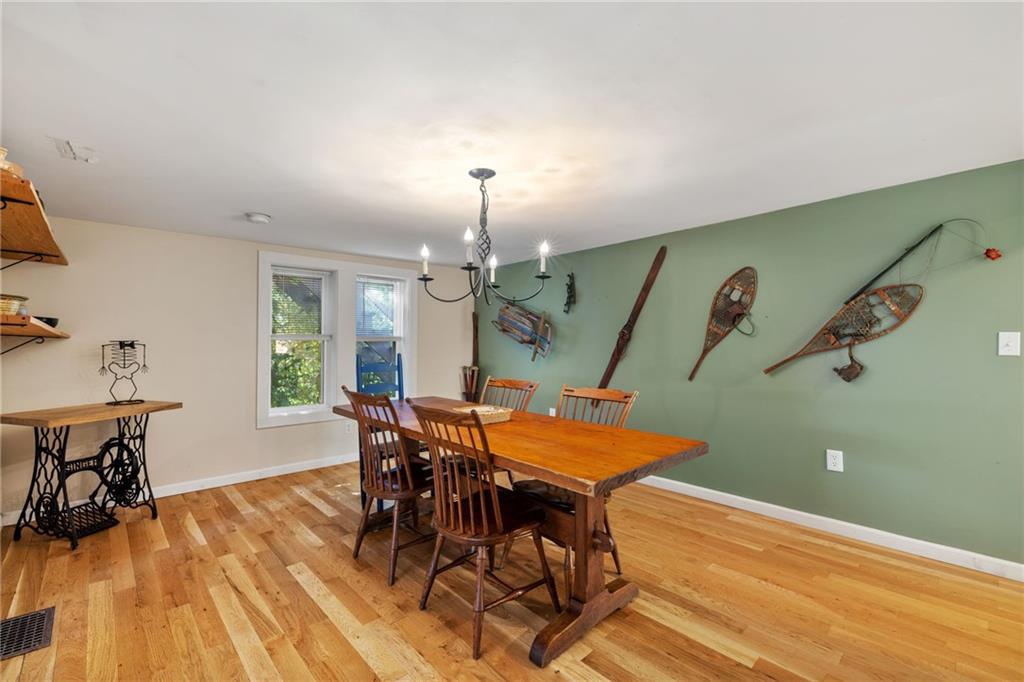 777 Main Street Addison, PA 15411 - Photo 9 of 35 a dining room with furniture and wooden floor