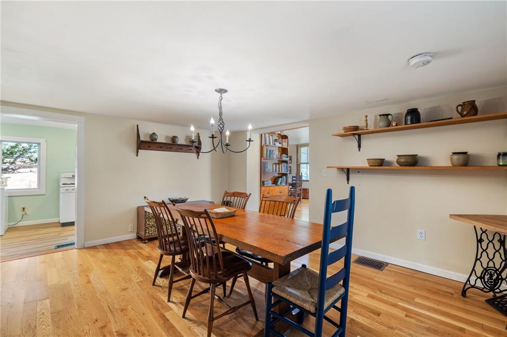 777 Main Street Addison, PA 15411 - Photo 10 of 35 a view of a dining room with furniture and wooden floor