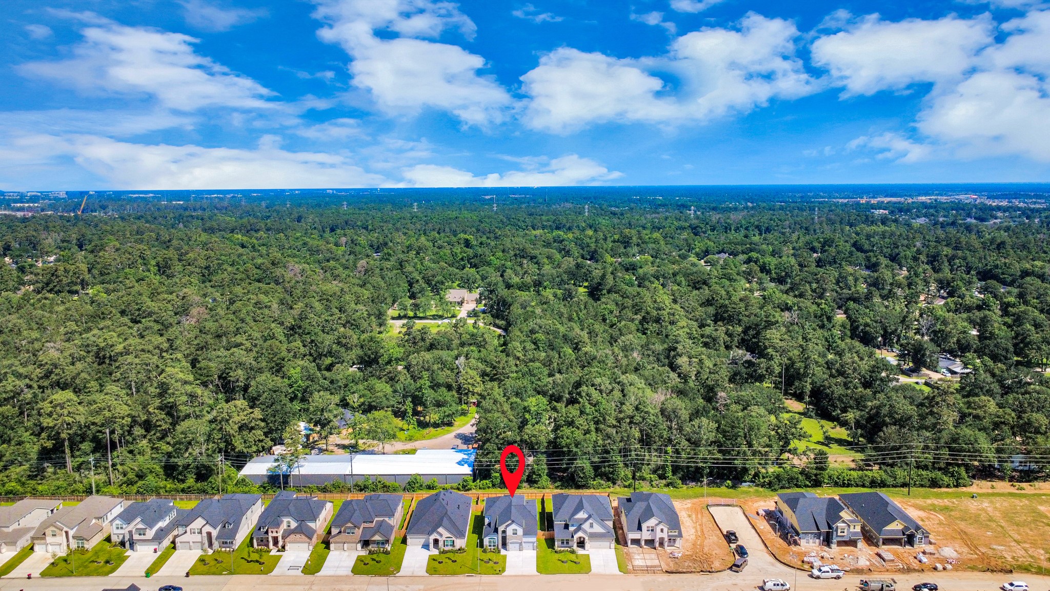 3035 Native Spg Drive Spring, TX 77373 - Photo 4 of 43 An aerial view of a spacious subdivision lot, highlighting a well-maintained yard and a fully fenced perimeter, offering both privacy and expansive outdoor space.