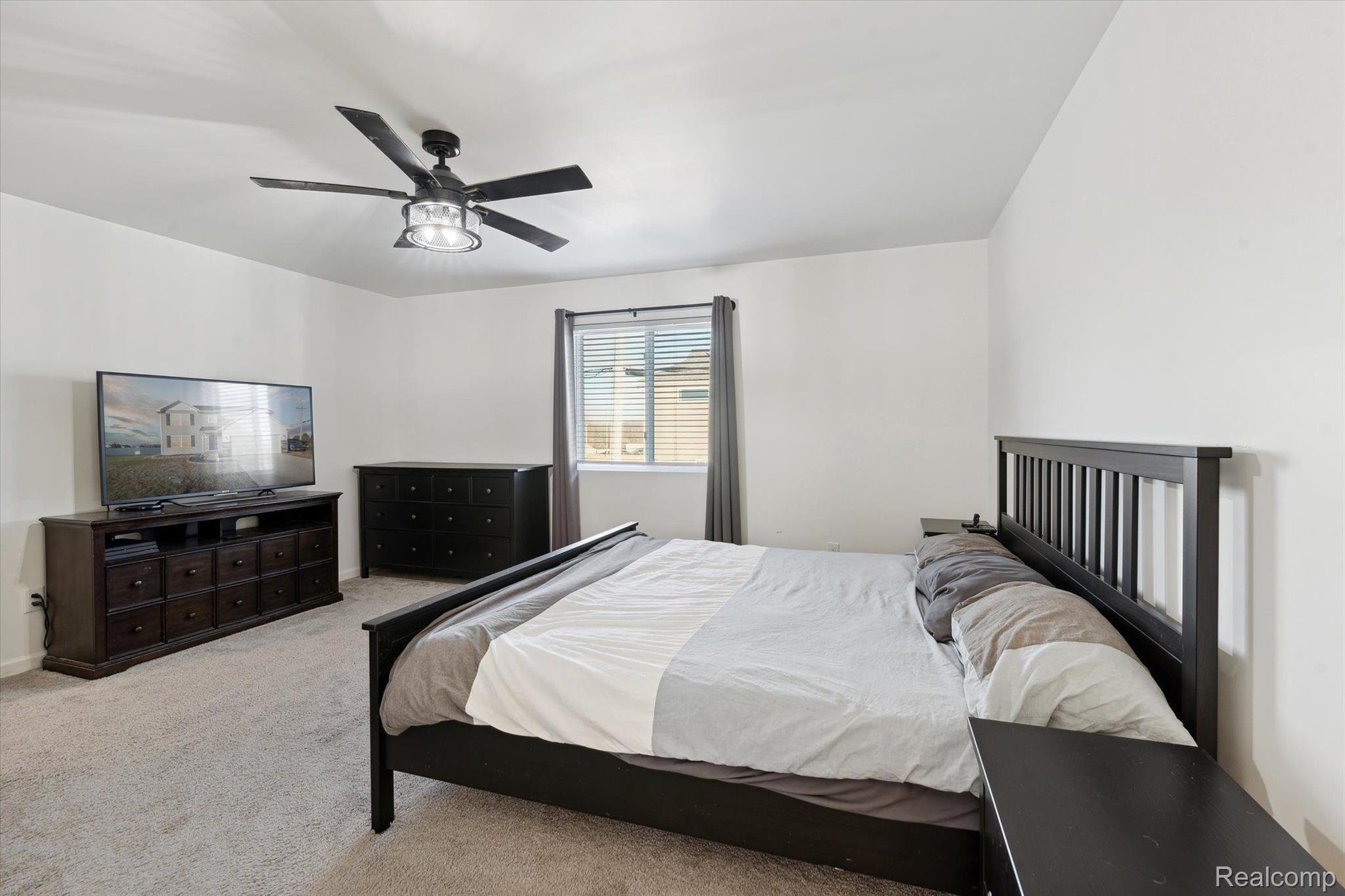 8024 Jordan Drive Jackson, MI 49201 - Photo 25 of 39 Spacious Primary with Ceiling Fan