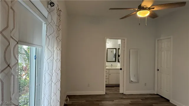 a view of an entryway with wooden floor