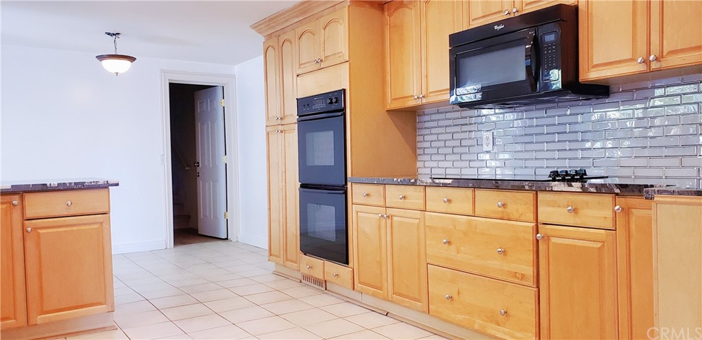 33 Valley, Unit 35 Irvine, CA 92612 - Photo 12 of 31 a view of kitchen with cabinets