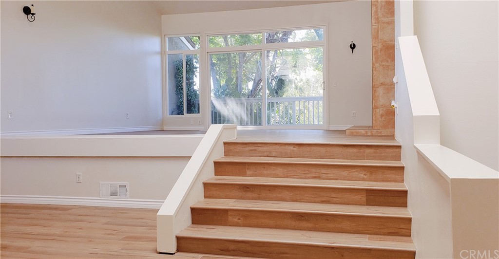 33 Valley, Unit 35 Irvine, CA 92612 - Photo 7 of 31 a view of staircase with white walls and windows