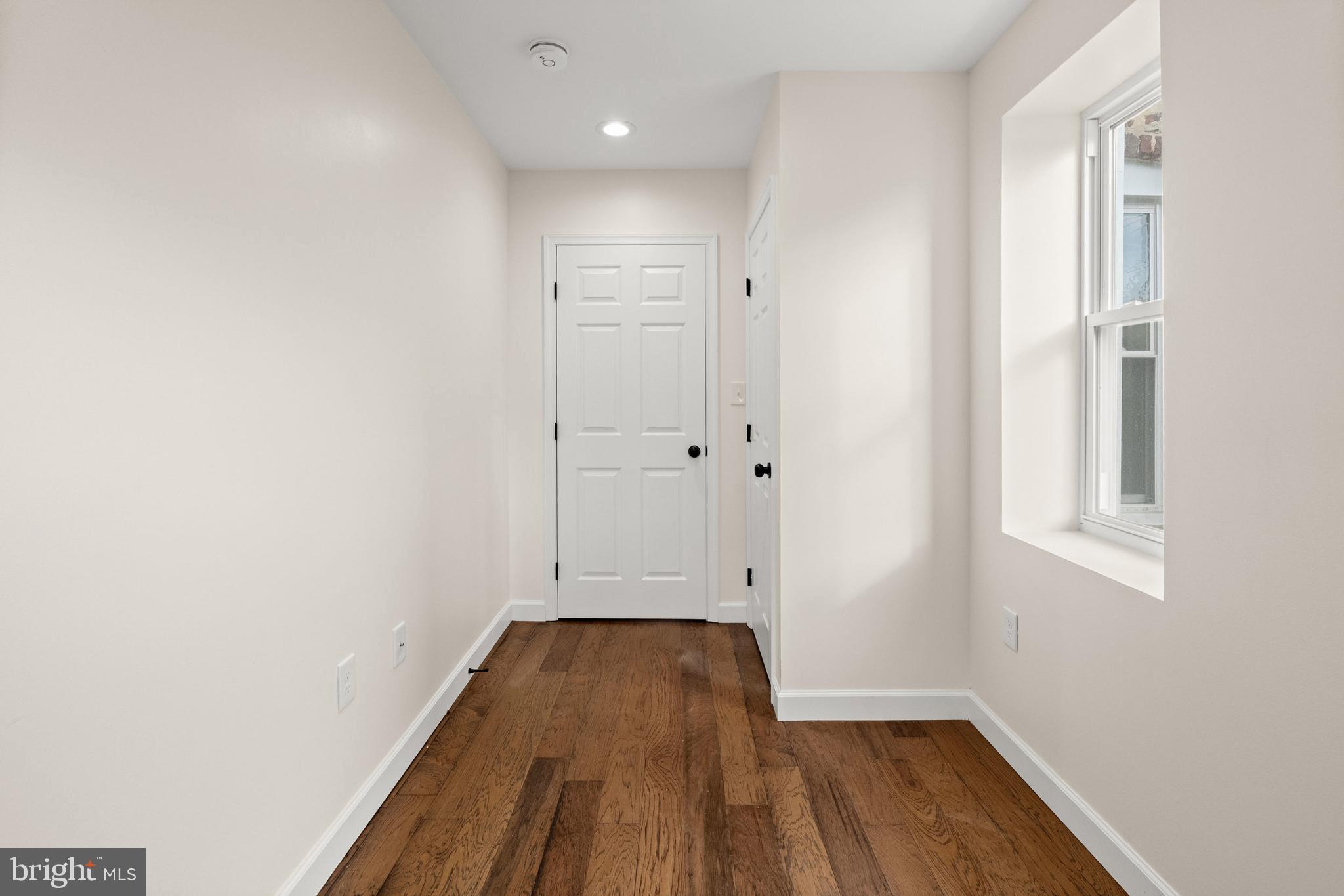 2815 West Cold Spring Lane Baltimore, MD 21215 - Photo 18 of 37 a view of a room with wooden floor and a window