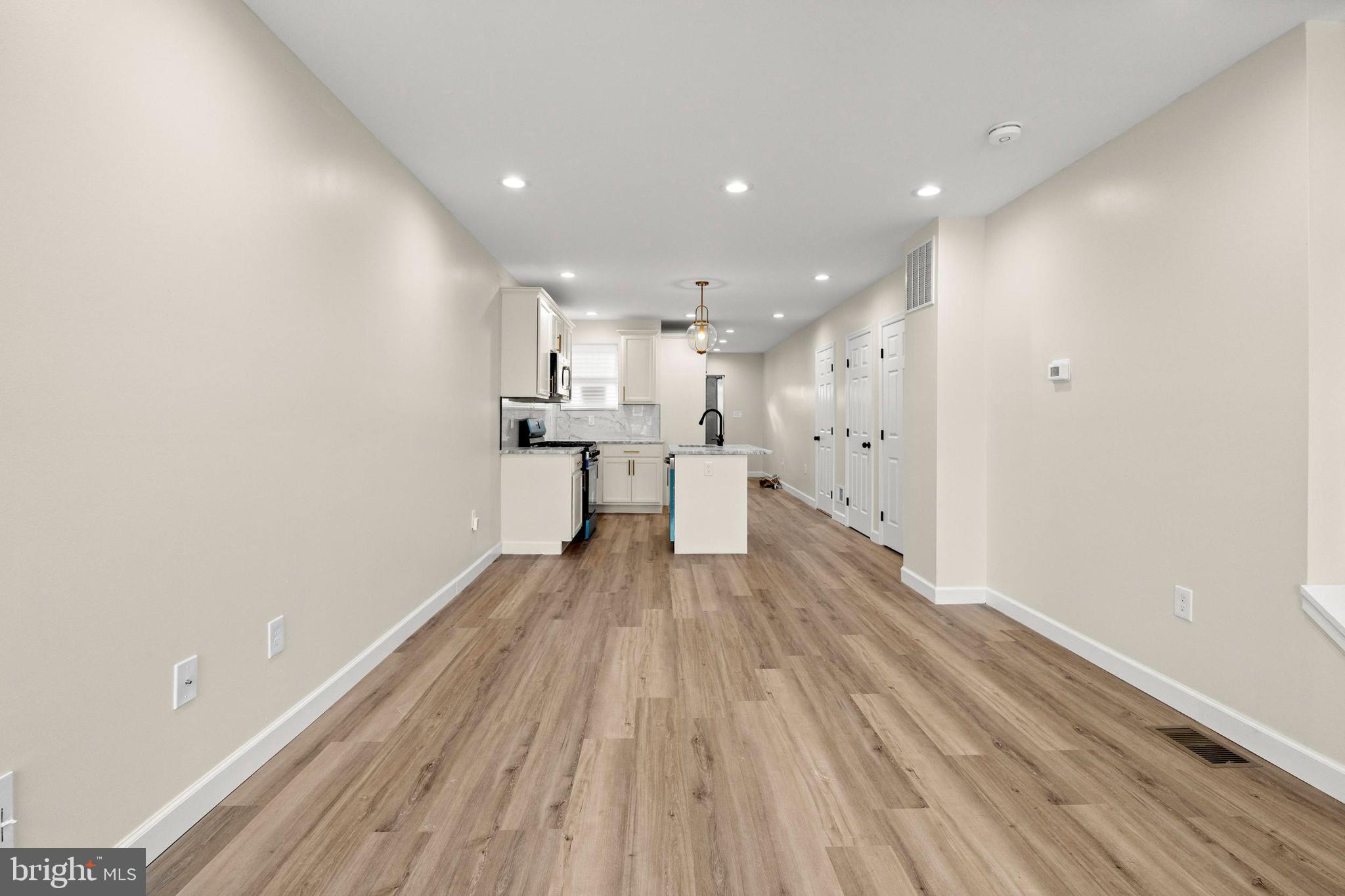 2815 West Cold Spring Lane Baltimore, MD 21215 - Photo 6 of 37 a view of kitchen with wooden floor and electronic appliances