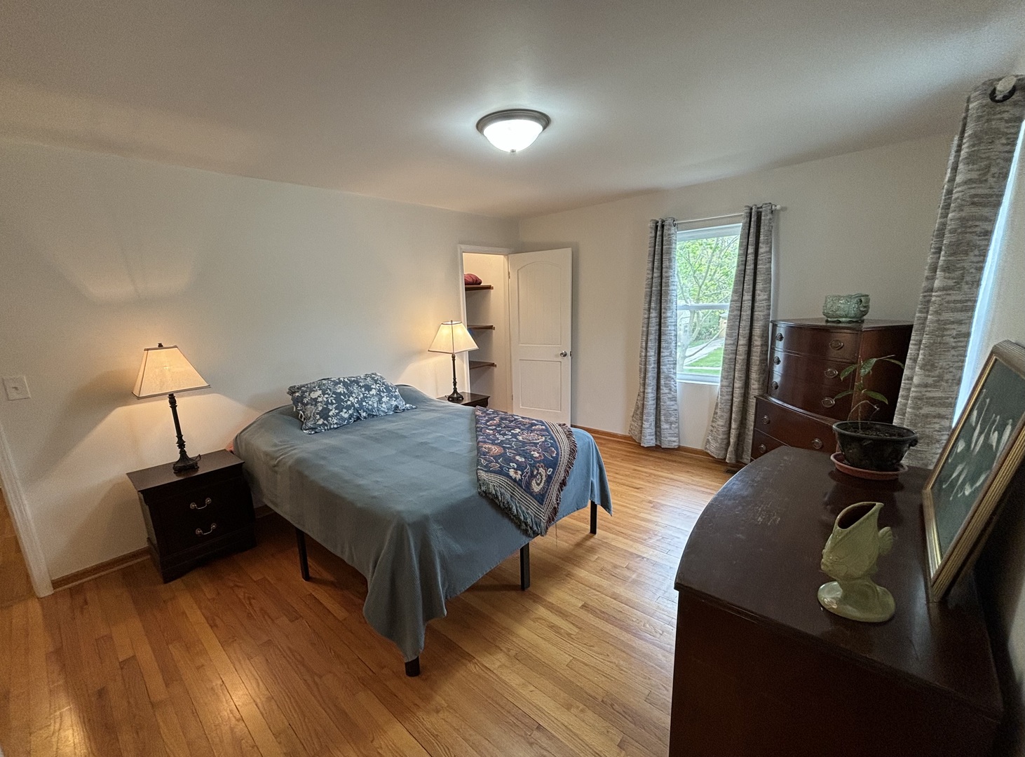 2461 Hawthorne Road Homewood, IL 60430 - Photo 12 of 37 a bedroom with a bed and wooden floor