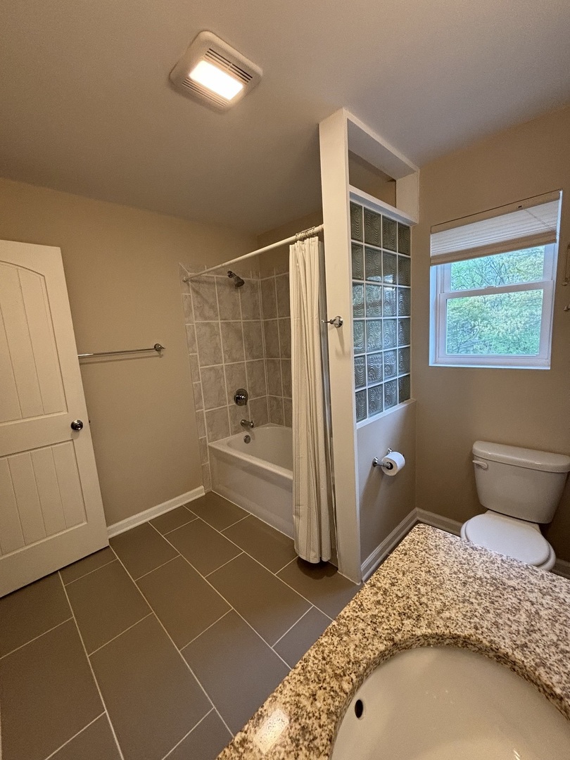 2461 Hawthorne Road Homewood, IL 60430 - Photo 16 of 37 a bathroom with a sink toilet and shower