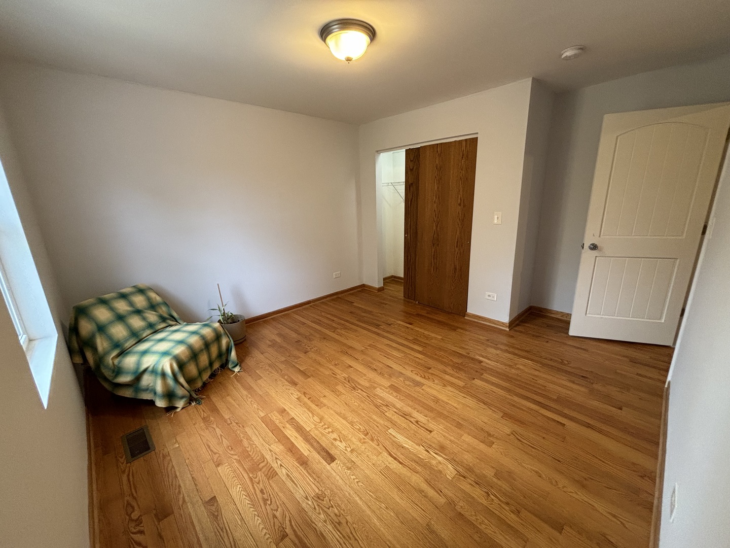 2461 Hawthorne Road Homewood, IL 60430 - Photo 18 of 37 a bedroom with a bed and a window