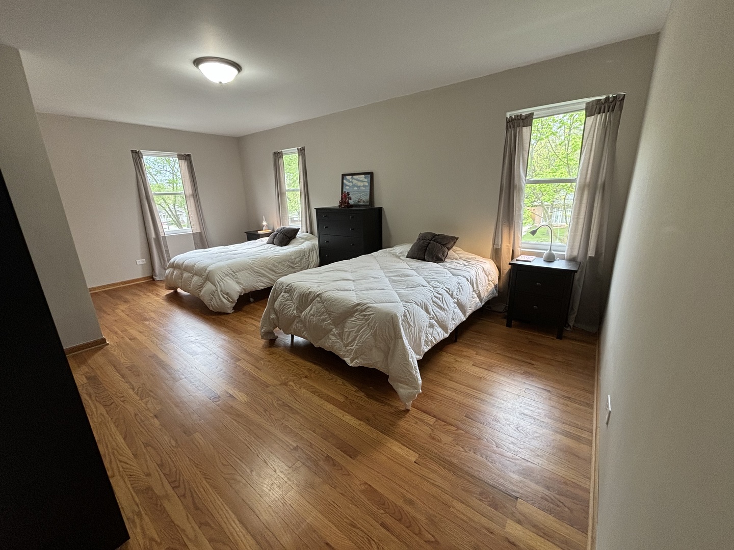 2461 Hawthorne Road Homewood, IL 60430 - Photo 25 of 37 a bedroom with two beds and wooden floor