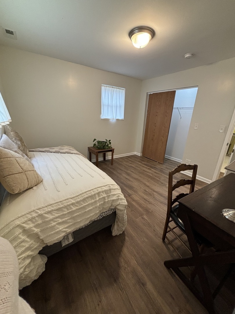 2461 Hawthorne Road Homewood, IL 60430 - Photo 32 of 37 a bedroom with a bed and dresser