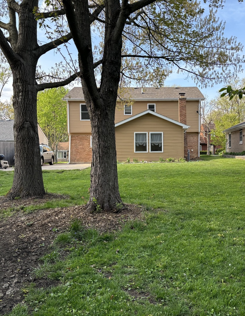 2461 Hawthorne Road Homewood, IL 60430 - Photo 36 of 37 a front view of a house with garden