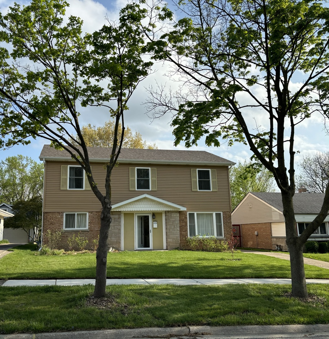 2461 Hawthorne Road Homewood, IL 60430 - Photo 37 of 37 a front view of a house with a yard