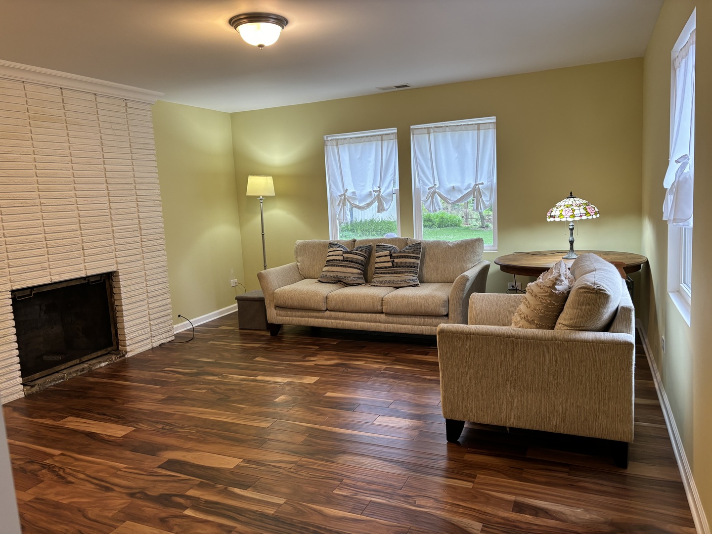 2461 Hawthorne Road Homewood, IL 60430 - Photo 8 of 37 a living room with furniture and a fireplace