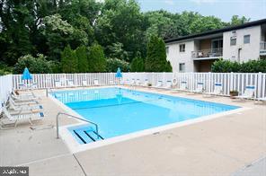7 Rockford Road, Unit E12 Wilmington, DE 19806 - Photo 15 of 17 a view of swimming pool with a patio