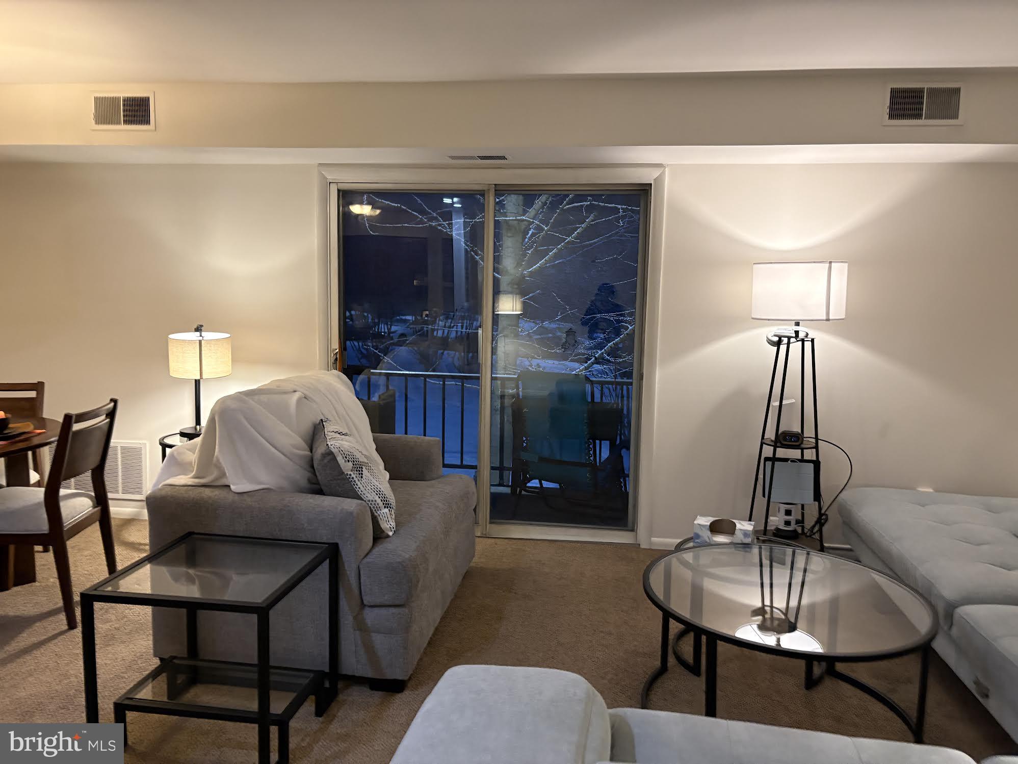 7 Rockford Road, Unit E12 Wilmington, DE 19806 - Photo 4 of 17 a living room with furniture and a fireplace