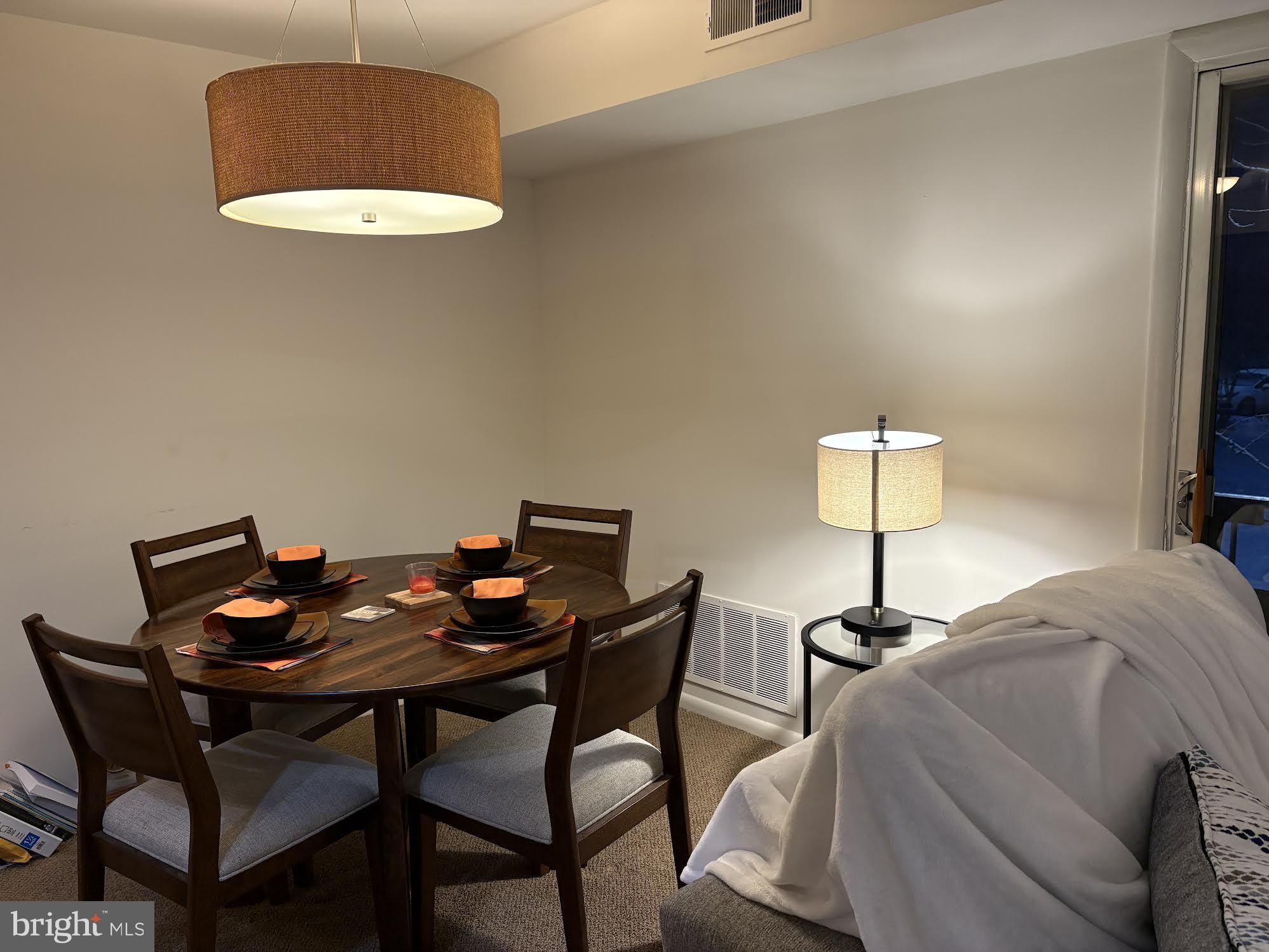 7 Rockford Road, Unit E12 Wilmington, DE 19806 - Photo 7 of 17 a table and chairs in a room