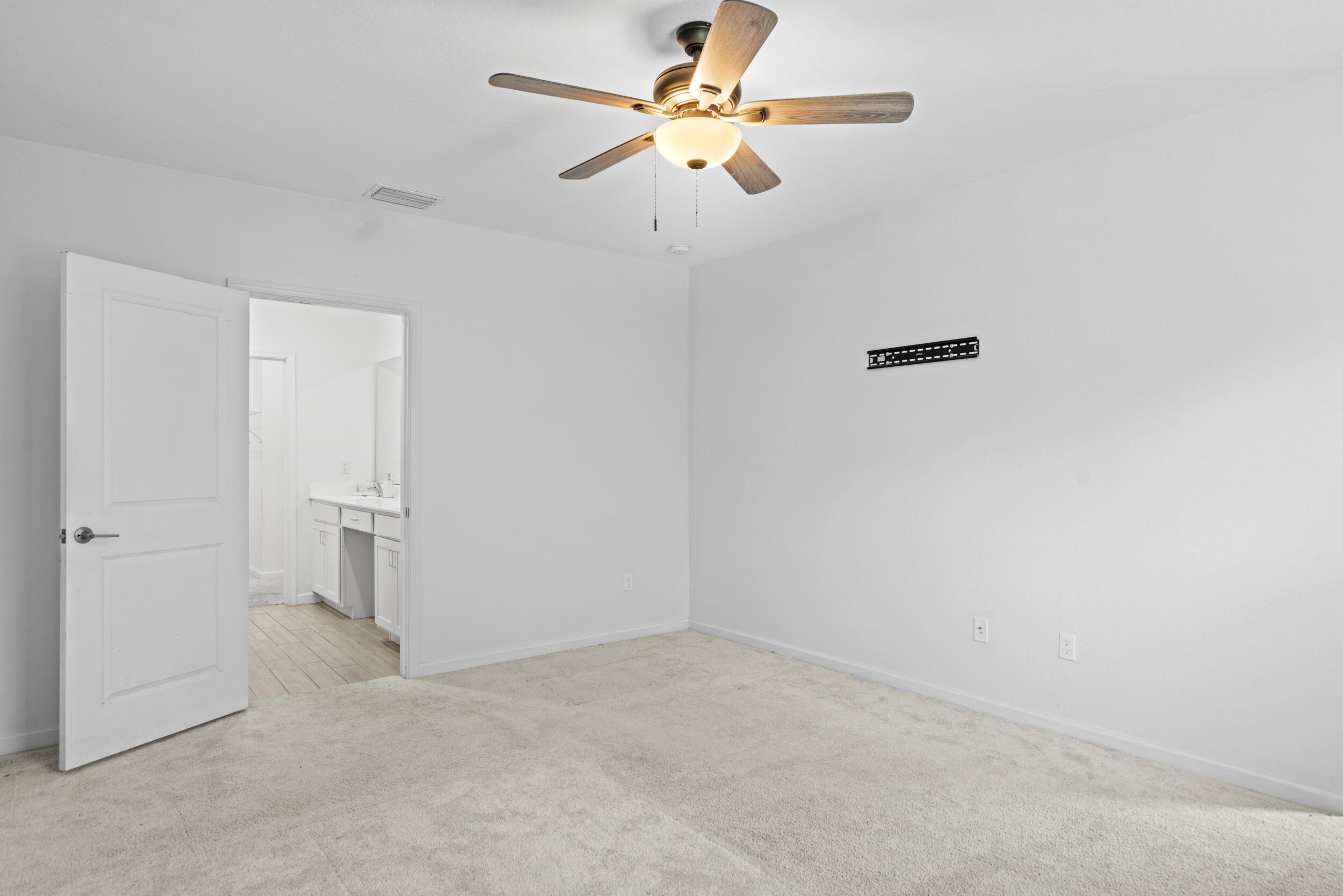 738 Worlington Lane Fort Pierce, FL 34947 - Photo 22 of 69 an empty room with a fan & a ceiling fan