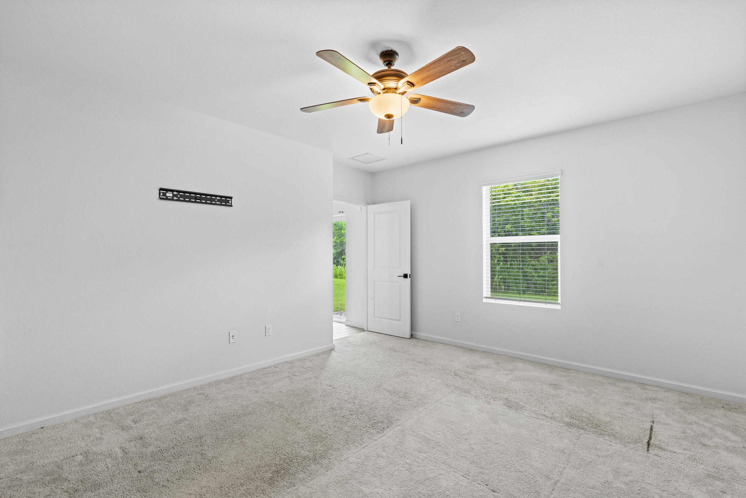 738 Worlington Lane Fort Pierce, FL 34947 - Photo 23 of 69 an empty room with ceiling fan and window