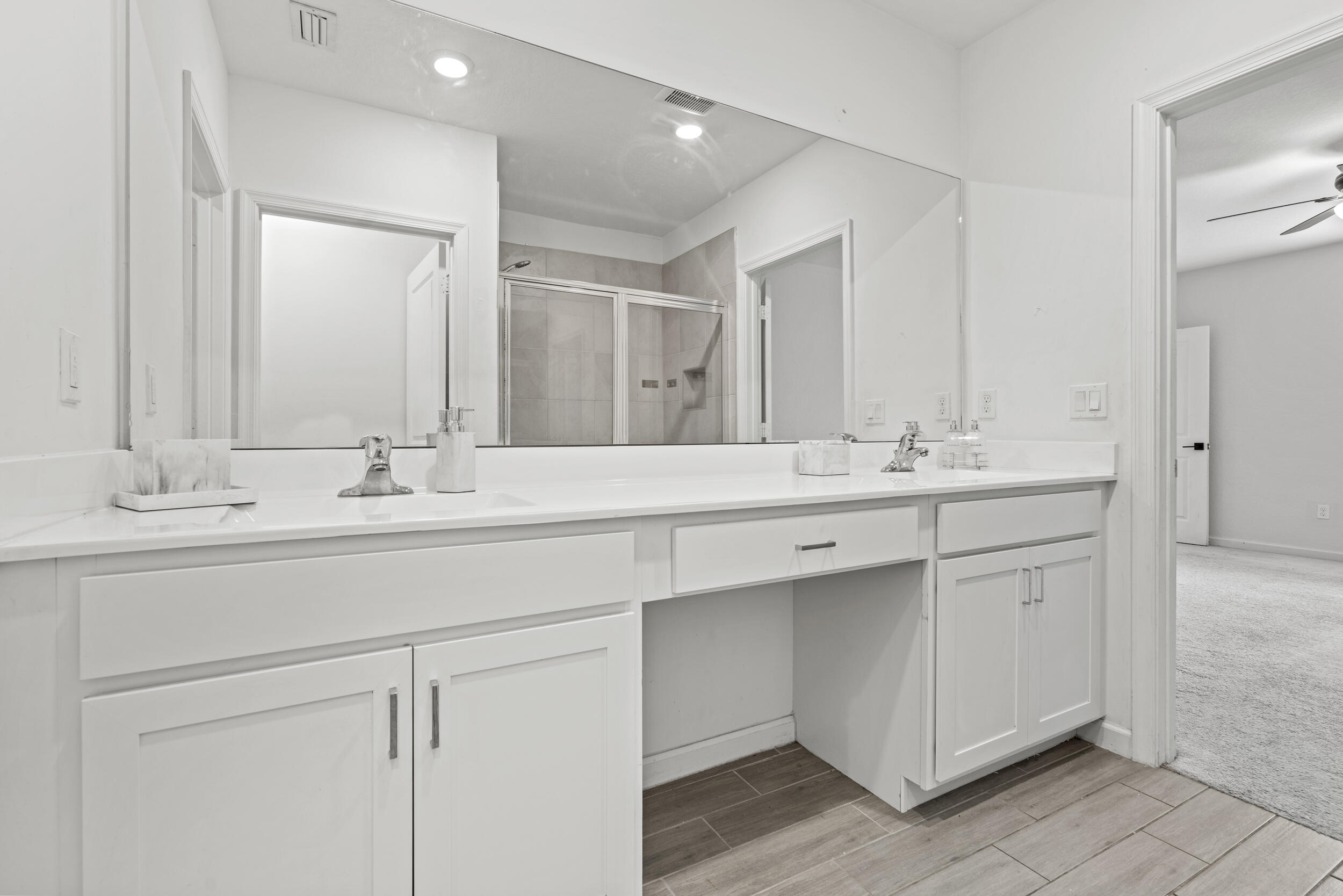 738 Worlington Lane Fort Pierce, FL 34947 - Photo 29 of 69 a bathroom with double vanity sink and a mirror