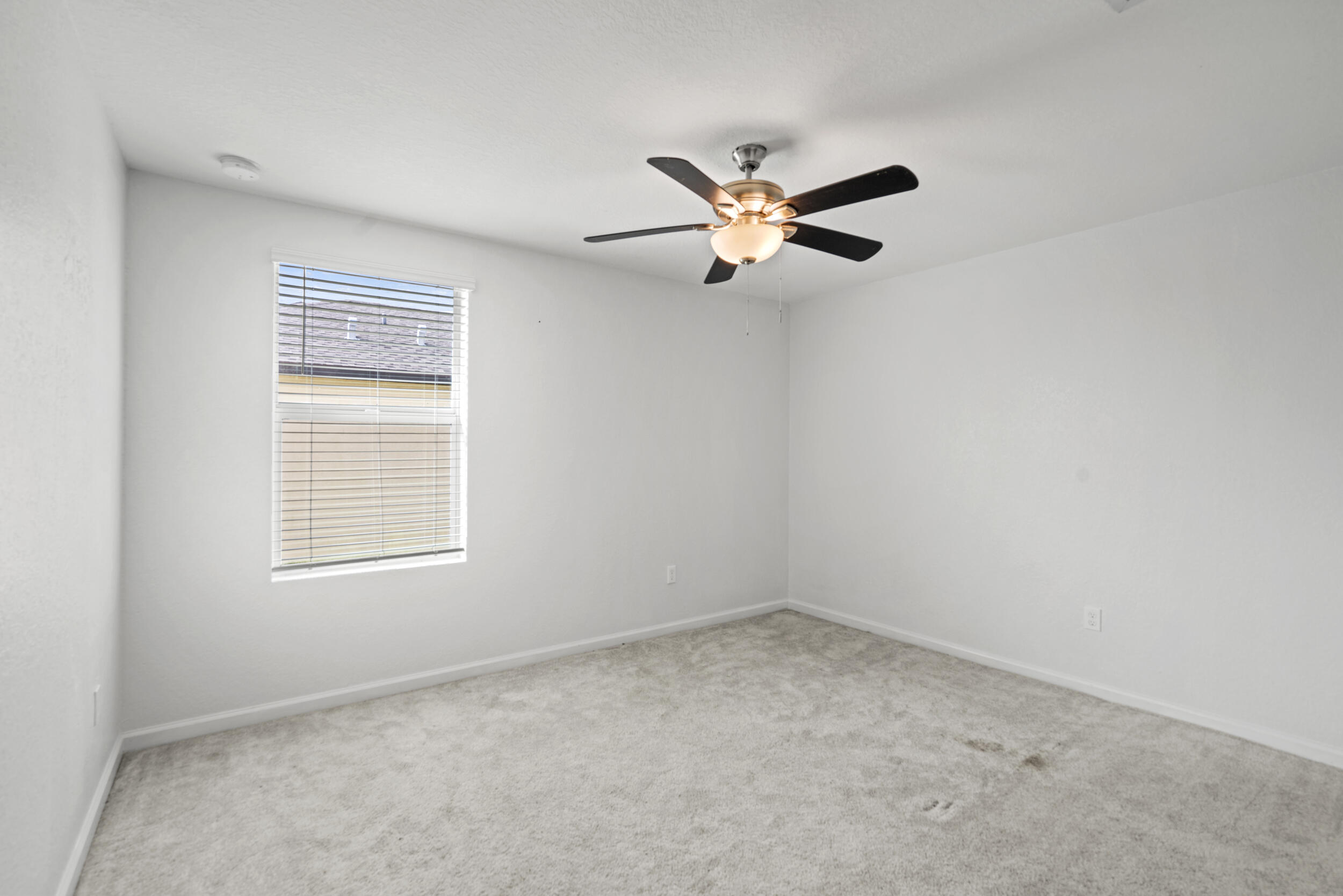 738 Worlington Lane Fort Pierce, FL 34947 - Photo 38 of 69 an empty room with a window and a fan
