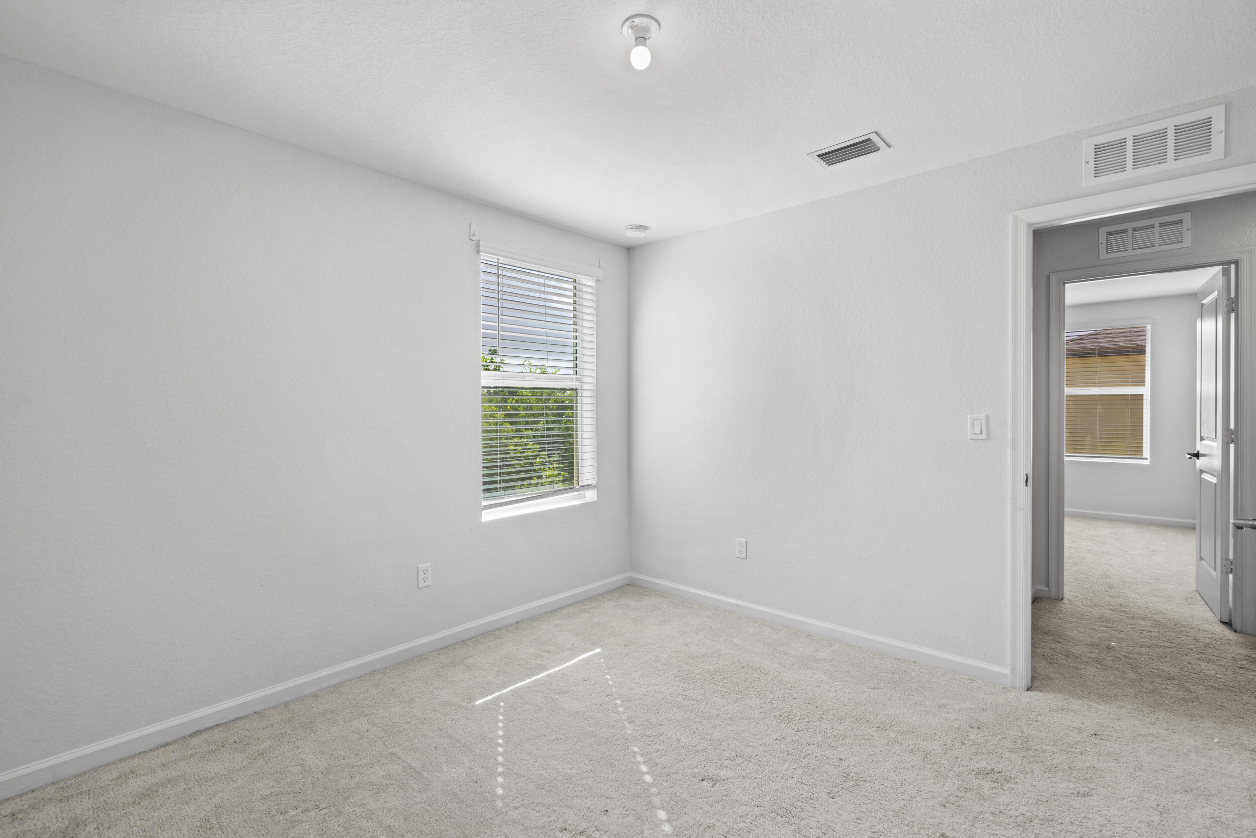 738 Worlington Lane Fort Pierce, FL 34947 - Photo 45 of 69 an empty room with windows and closet