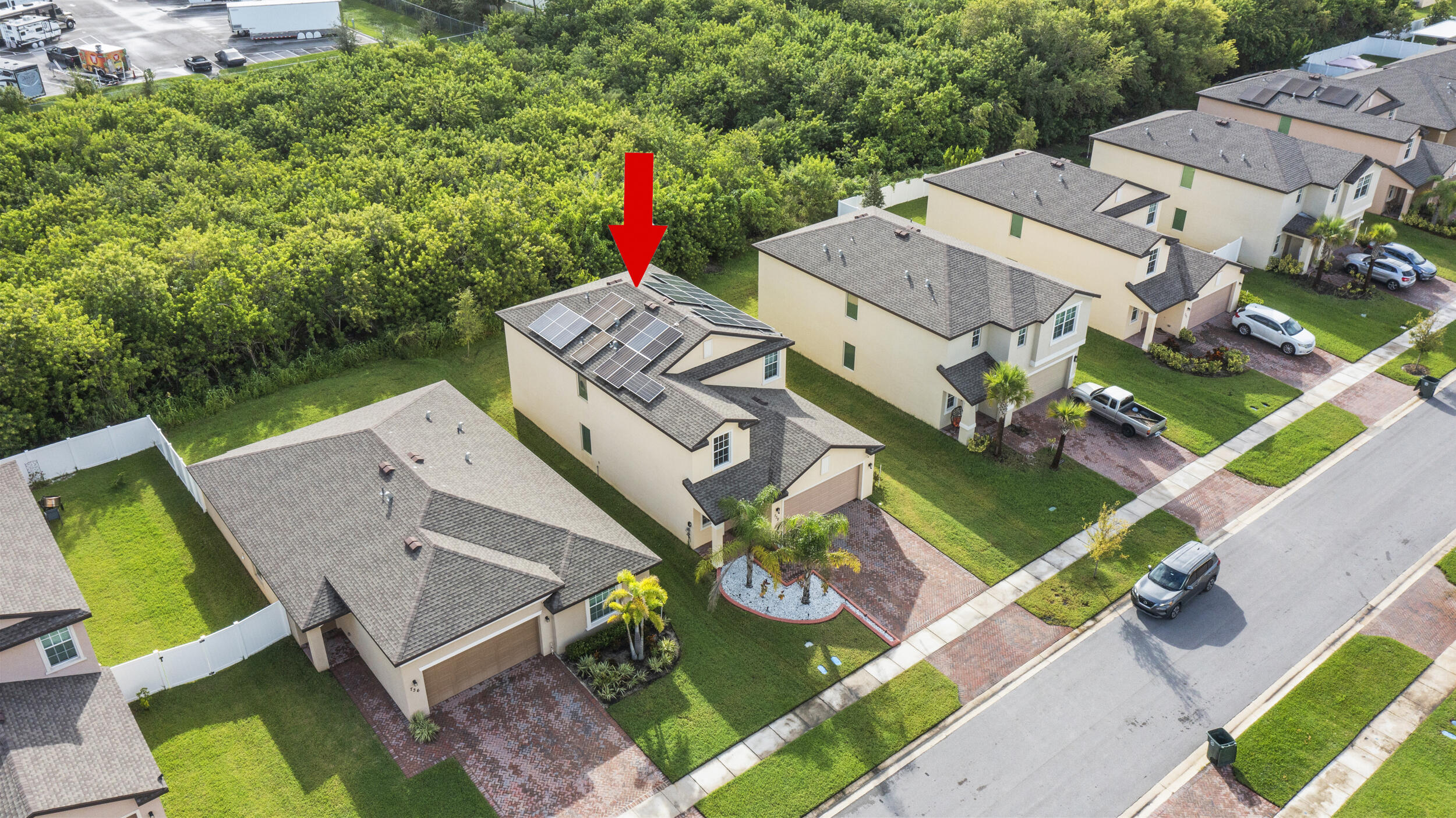 738 Worlington Lane Fort Pierce, FL 34947 - Photo 69 of 69 an aerial view of a house with a yard and a large tree