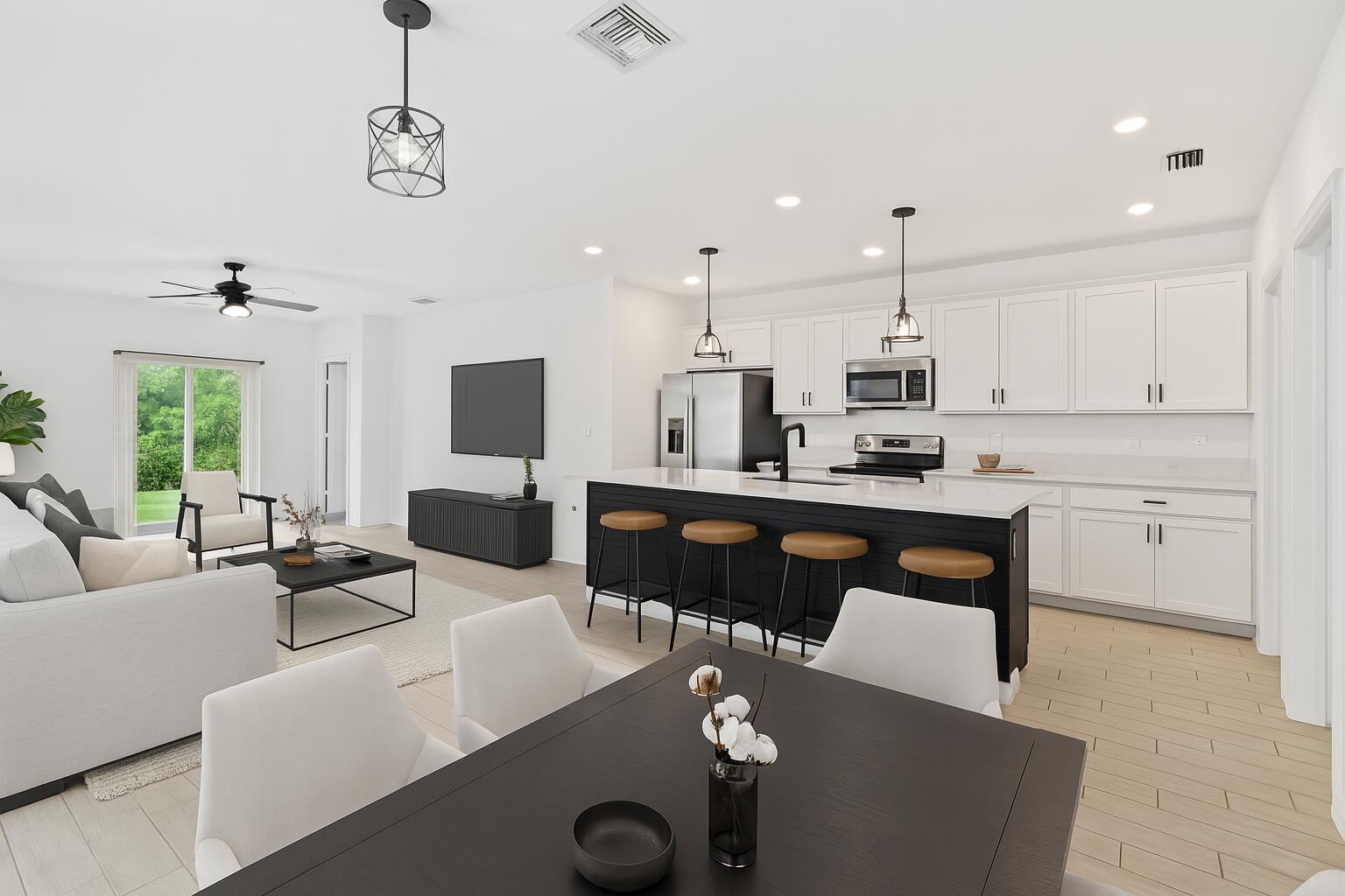 738 Worlington Lane Fort Pierce, FL 34947 - Photo 7 of 69 a living room with kitchen island furniture and a flat screen tv