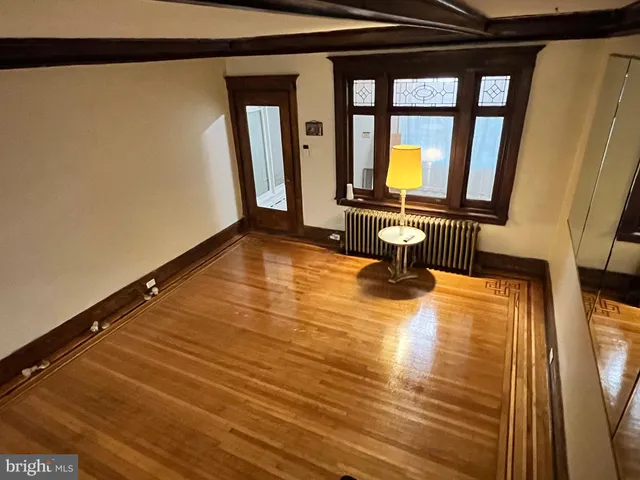 an empty room with entrance door