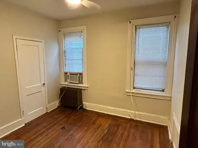 a view of hallway with a door