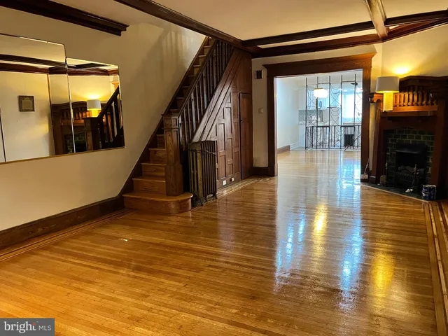 a view of an entryway wooden floor and fire place
