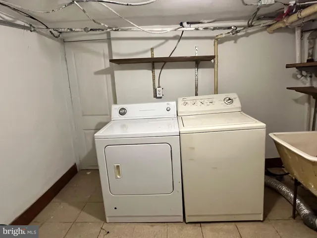 a white toilet sitting next to a bathroom sink