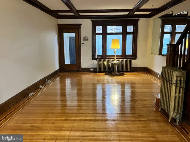 a view of kitchen with furniture and stainless steel appliances