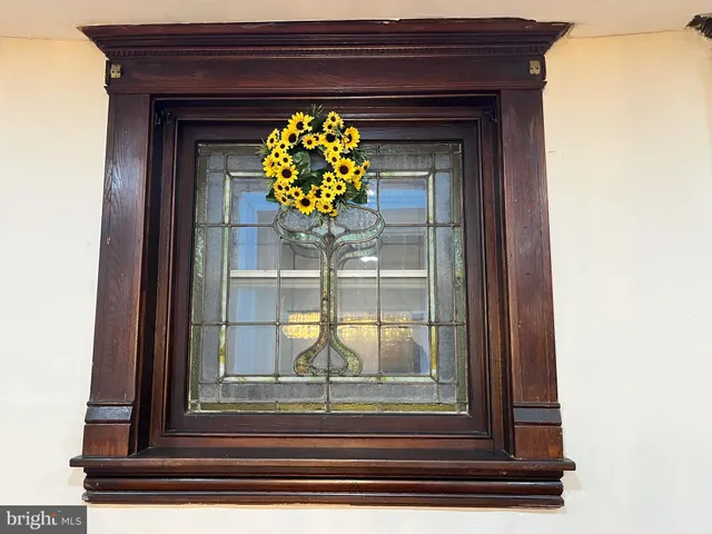 a view of livingroom with couch and floor to ceiling window