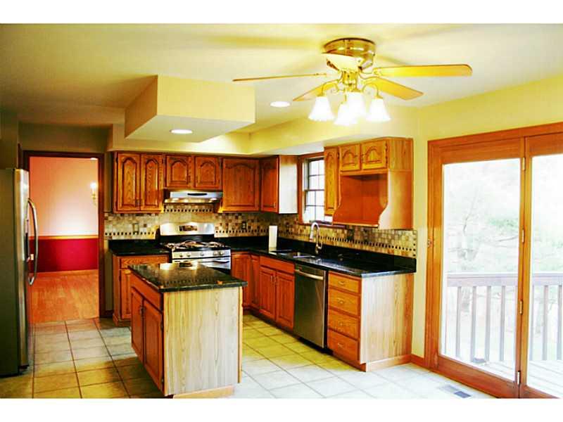 Kitchen. PLENTY OF ROOM IN THE EAT-IN KITCHEN WITH WALK OUT TO DECK.