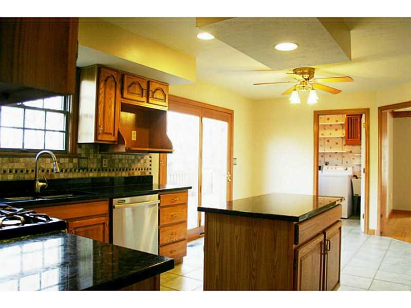 Kitchen. STAINLESS STEEL APPLIANCES AND GRANITE COUNTERTOPS.