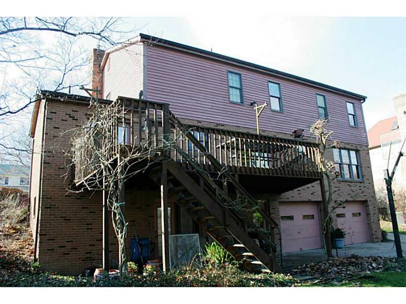 10126 Deer View Point Road Wexford, PA 15090 - Photo 22 of 25 Exterior Back. ENJOY THE SEASONS FROM THE LARGE DECK; WALKOUT TO THE REAR YARD FROM THE FINISHED BASEMENT.