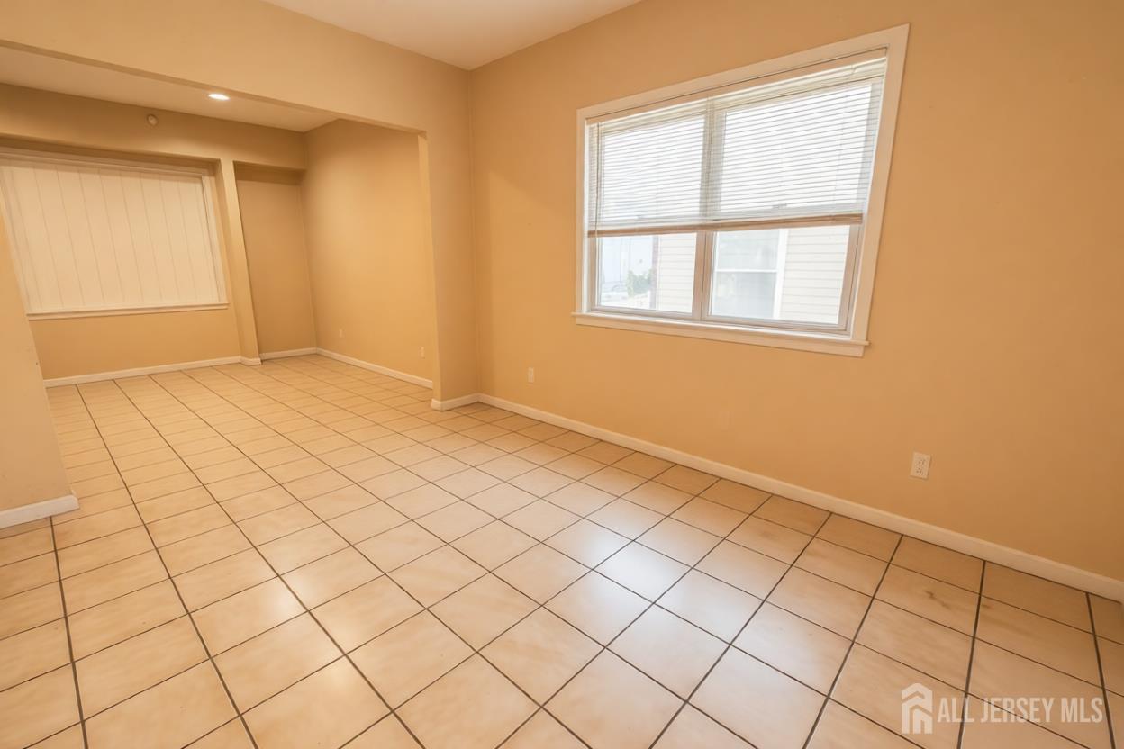 269 Silzer Street Perth Amboy, NJ 08861 - Photo 10 of 13 a view of an empty room and window