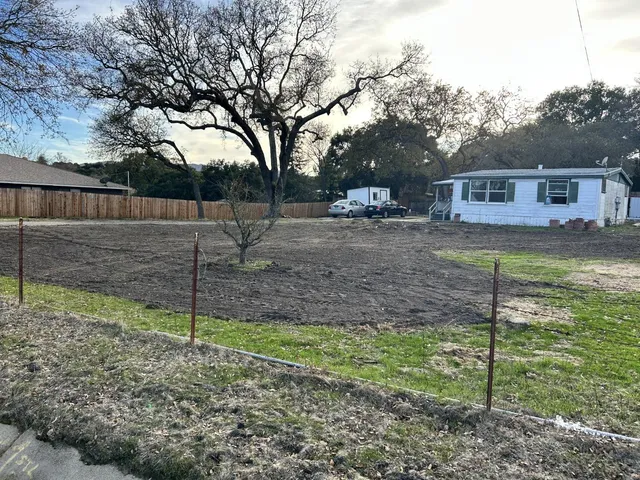 a backyard of a house with lots of green space