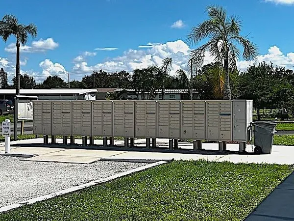 a view of swimming pool with outdoor seating and plants
