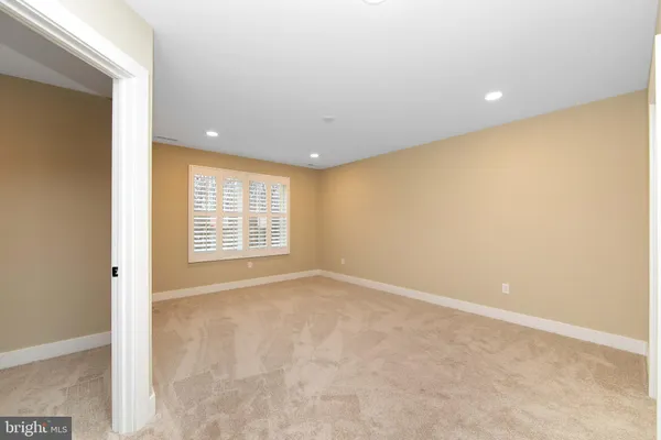 an empty room with a bathroom