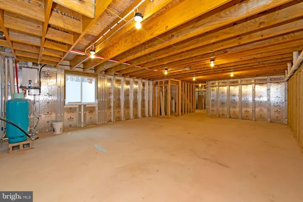 a view of a white house with a yard covered in snow