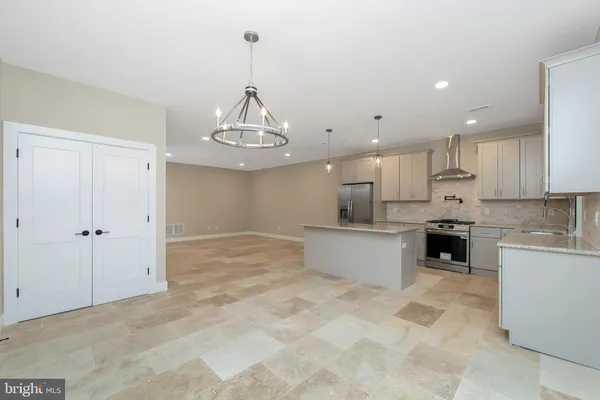 a kitchen with a stove and a sink