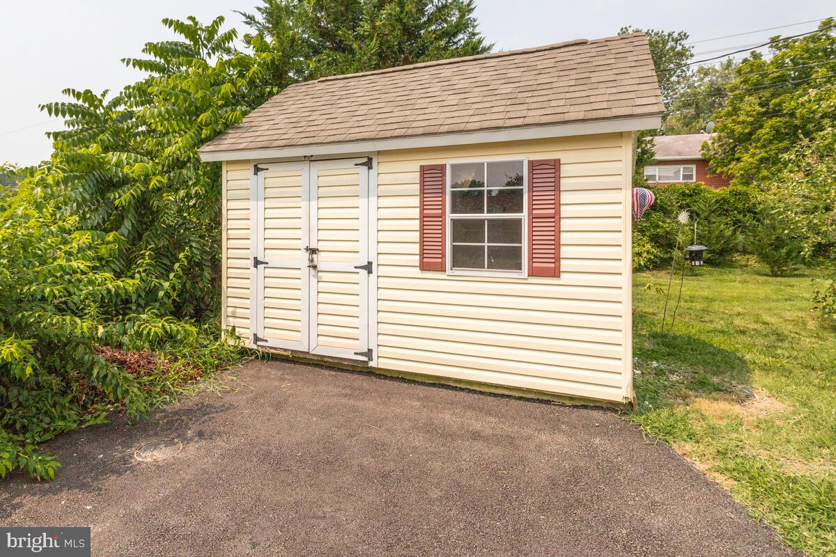 302 Homewood Road Linthicum, MD 21090 - Photo 38 of 56 shed storage as well as area down outside stairs
