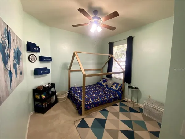 a bedroom with a bed and cabinets