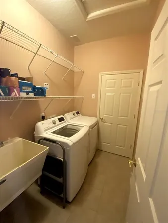 a utility room with dryer and washer
