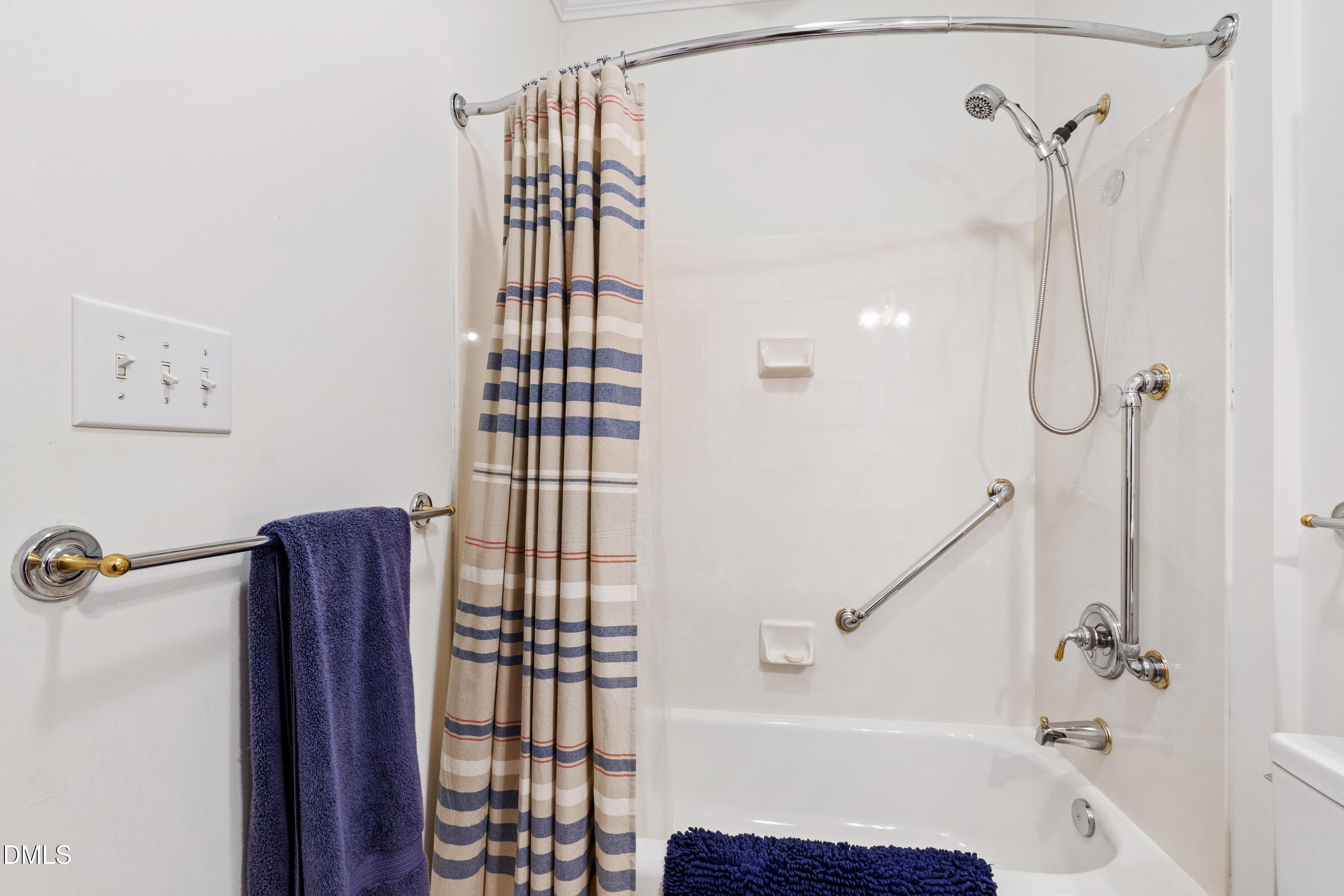 3700 Baron Cooper Pass, Unit 105 Raleigh, NC 27612 - Photo 35 of 49 a bathroom with a shower and a tub