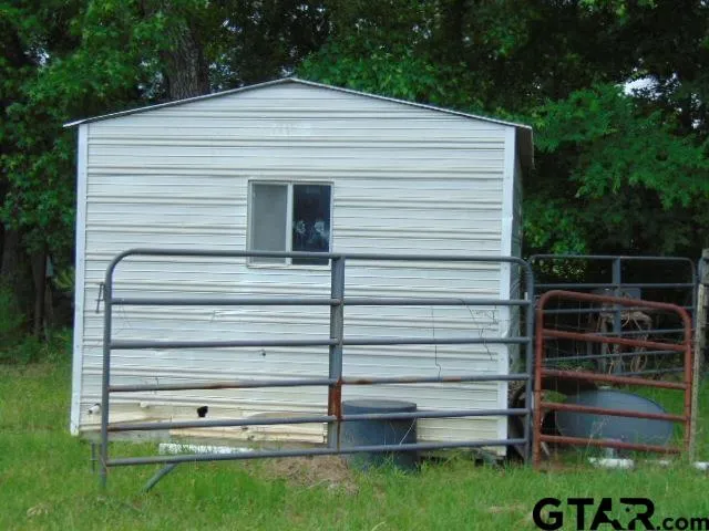 a front view of a house with a gate